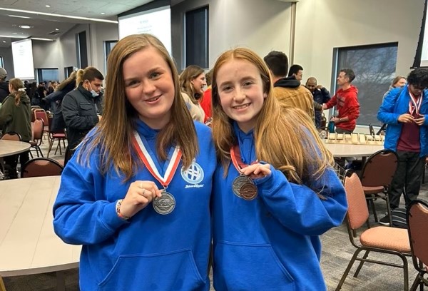 8th graders Paityn Headley and Stephanie Leach display their medals at the Science Olympiad event held on March 11 at Delaware State University.