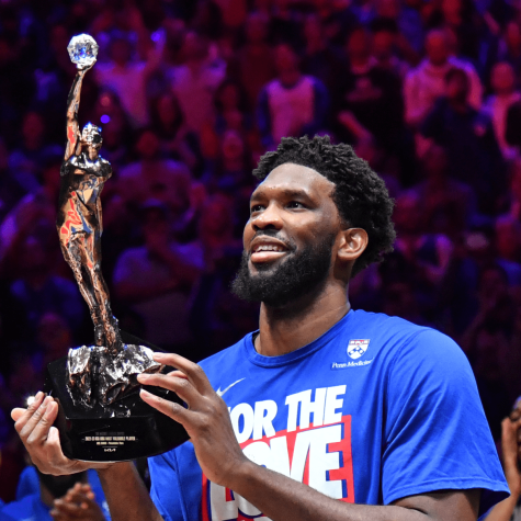 Joel Embiid holds up his 2022-23 NBA MVP award before his Philadelphia 76ers home playoff game against the Boston Celtics on May 5, 2023.